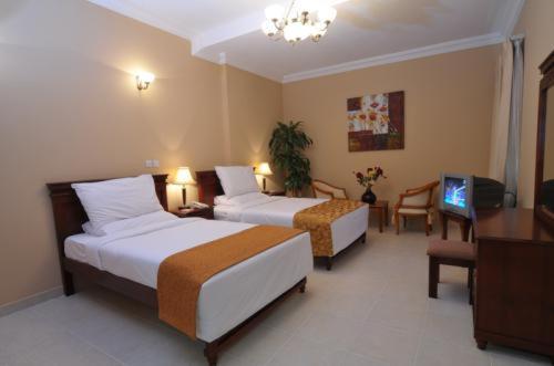 Le Grand Hotel Doha Kamer foto